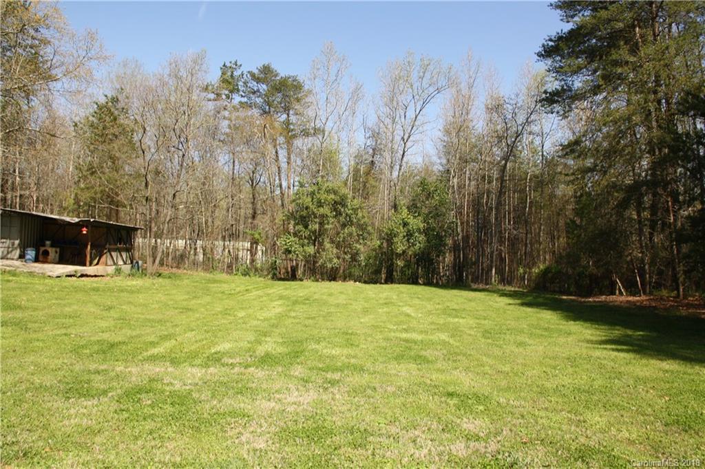 878 Sherwood Road Clover, SC 29710 - Photo 16 of 21 a view of outdoor space with green field and trees