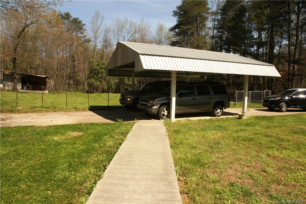 878 Sherwood Road Clover, SC 29710 - Photo 21 of 21 a view of a house with a backyard patio and swimming pool