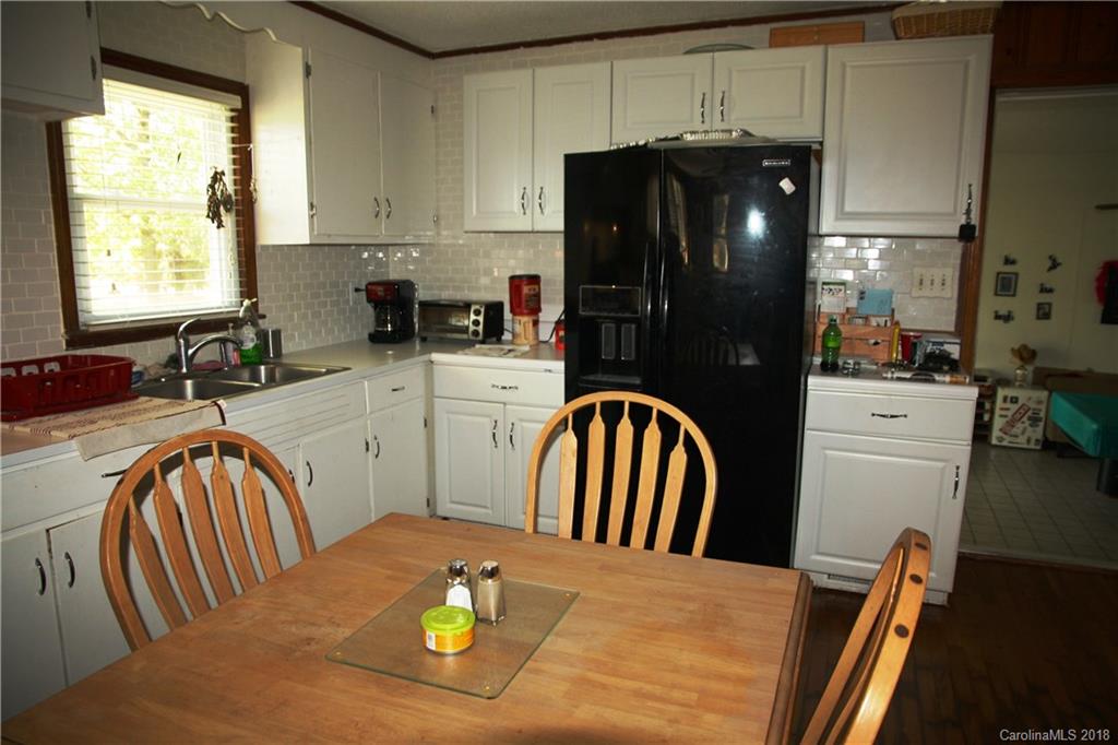 878 Sherwood Road Clover, SC 29710 - Photo 8 of 21 a kitchen with stainless steel appliances granite countertop a refrigerator a stove a sink dishwasher and microwave