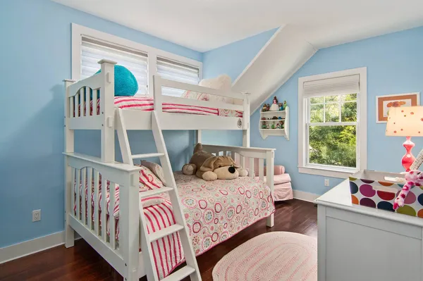 a bedroom with furniture and a window