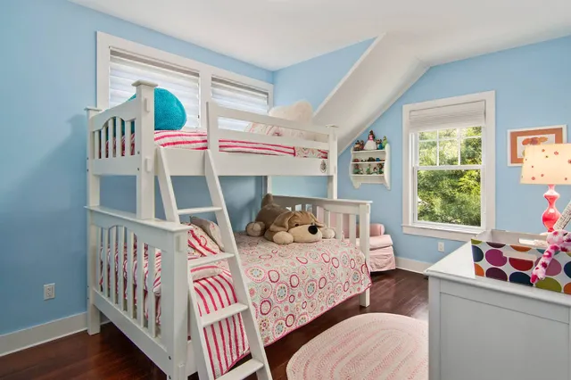 a bedroom with furniture and a window