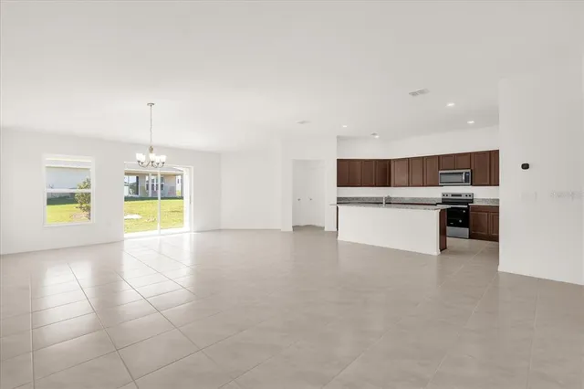 a view of a kitchen with a stove cabinets