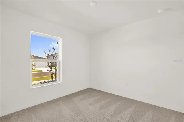 a view of an empty room and window