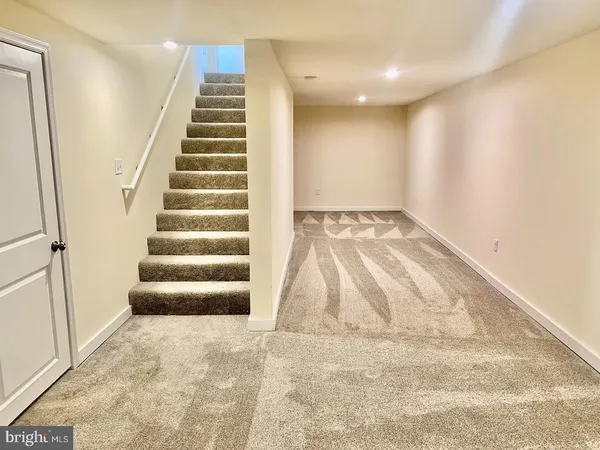 a view of an empty room with stairs