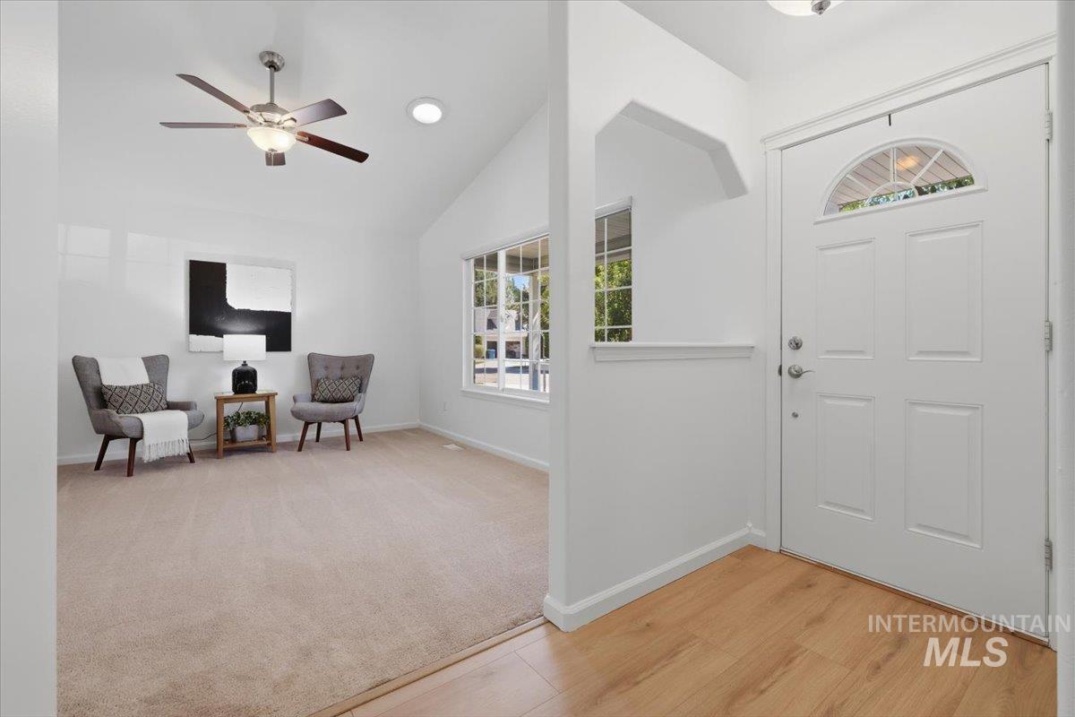 2075 North Springland Place Boise, ID 83713 - Photo 6 of 49 Entry with wood-finish flooring transitioning to carpeted living space