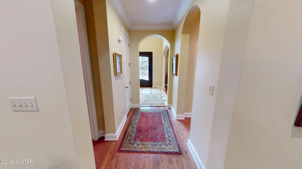 a view of entryway with wooden floor