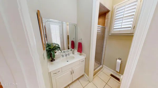 a view of a hallway with wooden floor and entryway