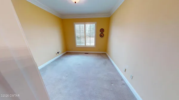 a bathroom with a sink a toilet a mirror and shower curtain