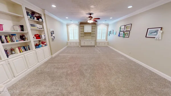 a view of an empty room with shelves