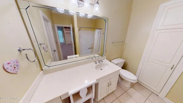 a view of a bathroom with sink and washing machine