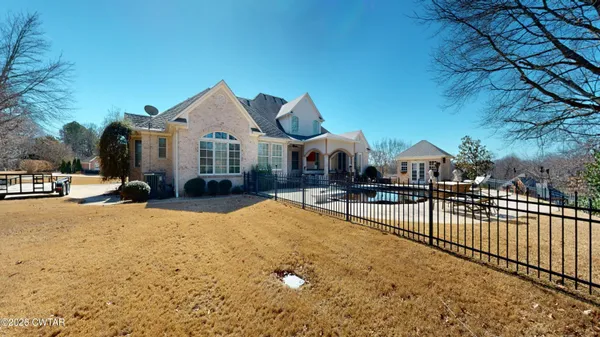 a dining room with furniture a rug and garden view