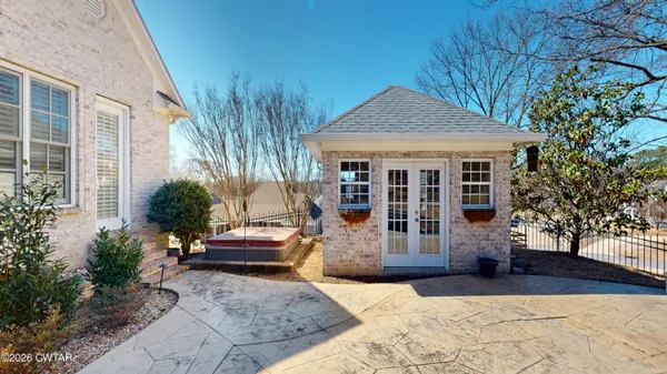 a view of a house with backyard and porch