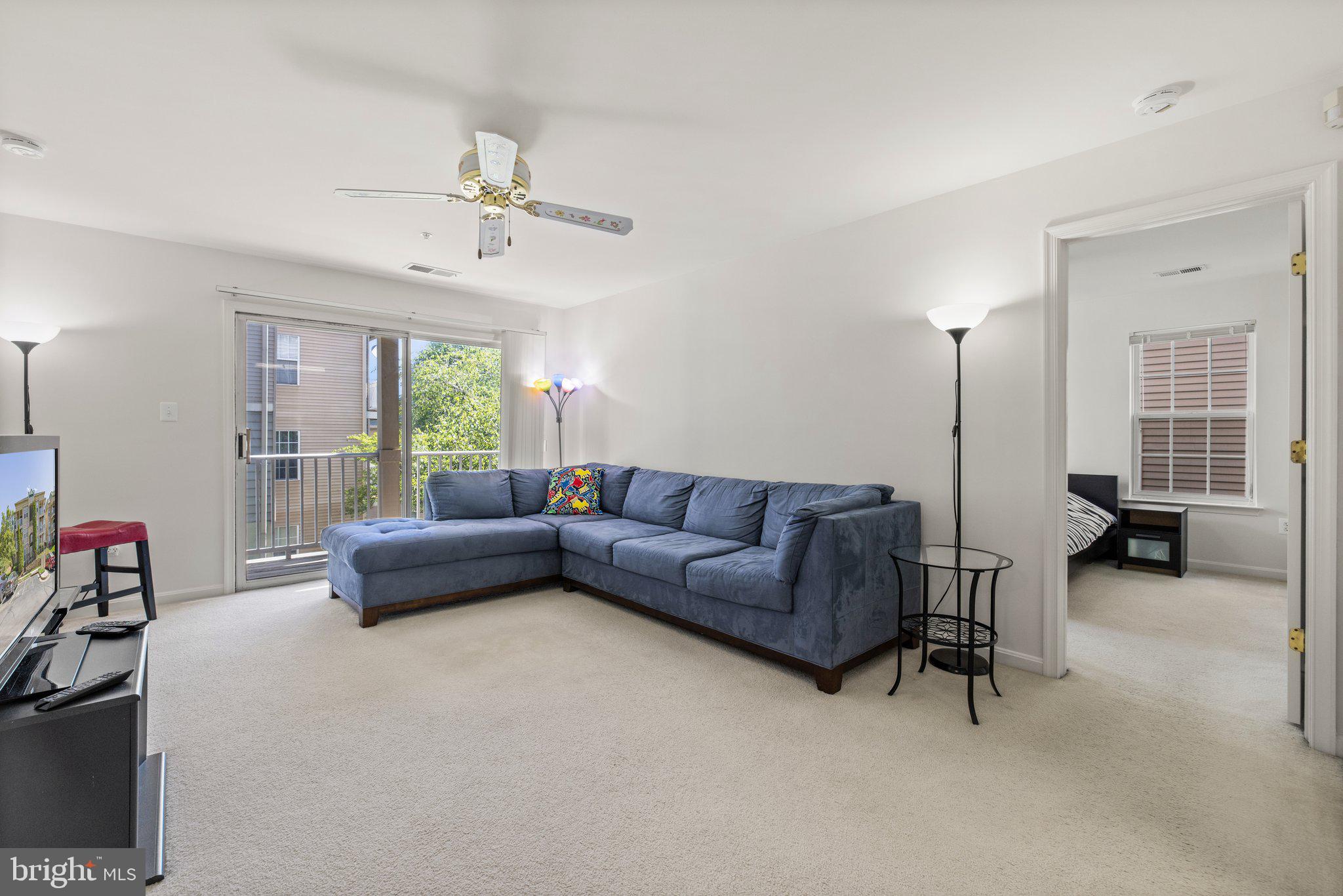 1049 Gardenview Loop, Unit 203 Woodbridge, VA 22191 - Photo 14 of 25 a living room with furniture and a large window