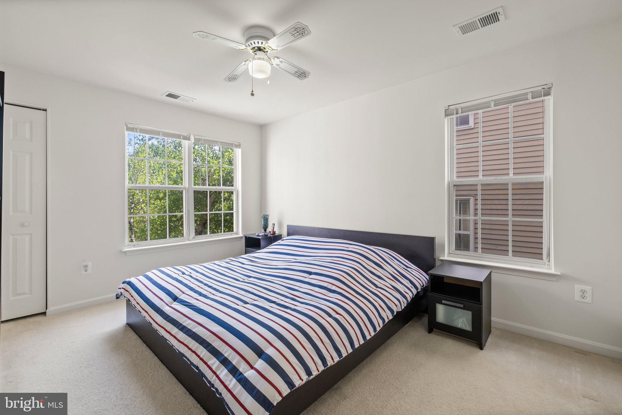 1049 Gardenview Loop, Unit 203 Woodbridge, VA 22191 - Photo 16 of 25 a bedroom with a bed and a window