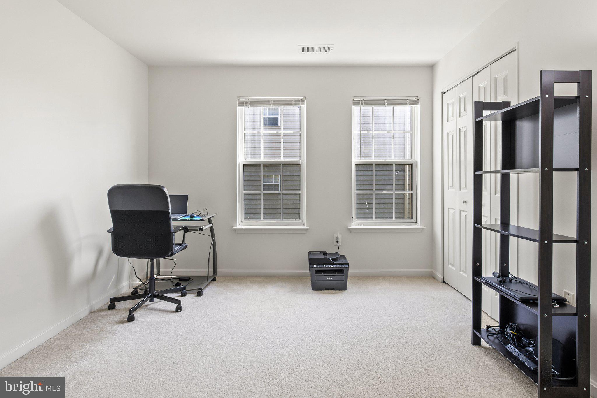 1049 Gardenview Loop, Unit 203 Woodbridge, VA 22191 - Photo 20 of 25 a view of a workspace with furniture and a window