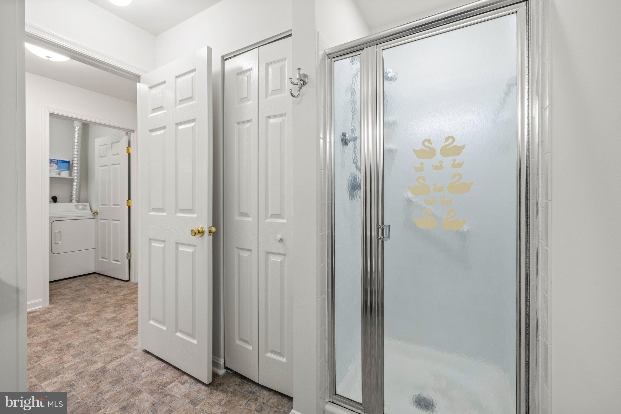 1049 Gardenview Loop, Unit 203 Woodbridge, VA 22191 - Photo 22 of 25 a bathroom with a shower and a glass door