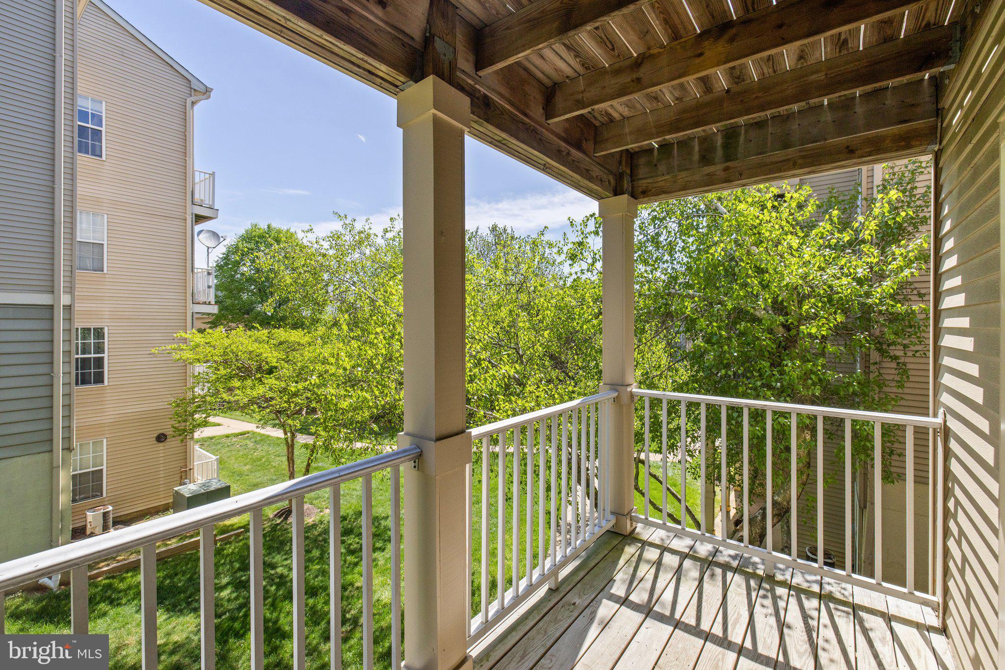 1049 Gardenview Loop, Unit 203 Woodbridge, VA 22191 - Photo 23 of 25 a view of a balcony with wooden floor