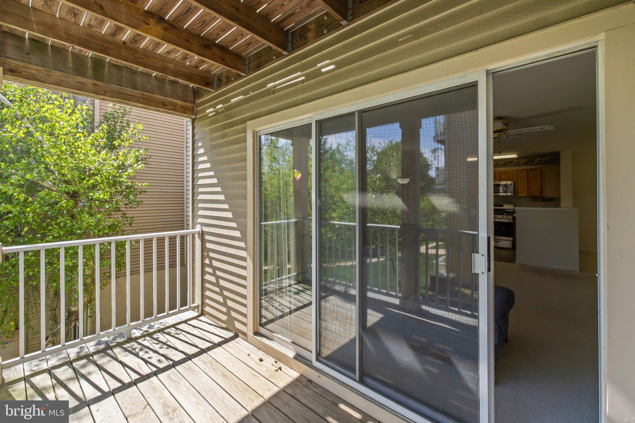 1049 Gardenview Loop, Unit 203 Woodbridge, VA 22191 - Photo 24 of 25 a balcony with view of swimming pool