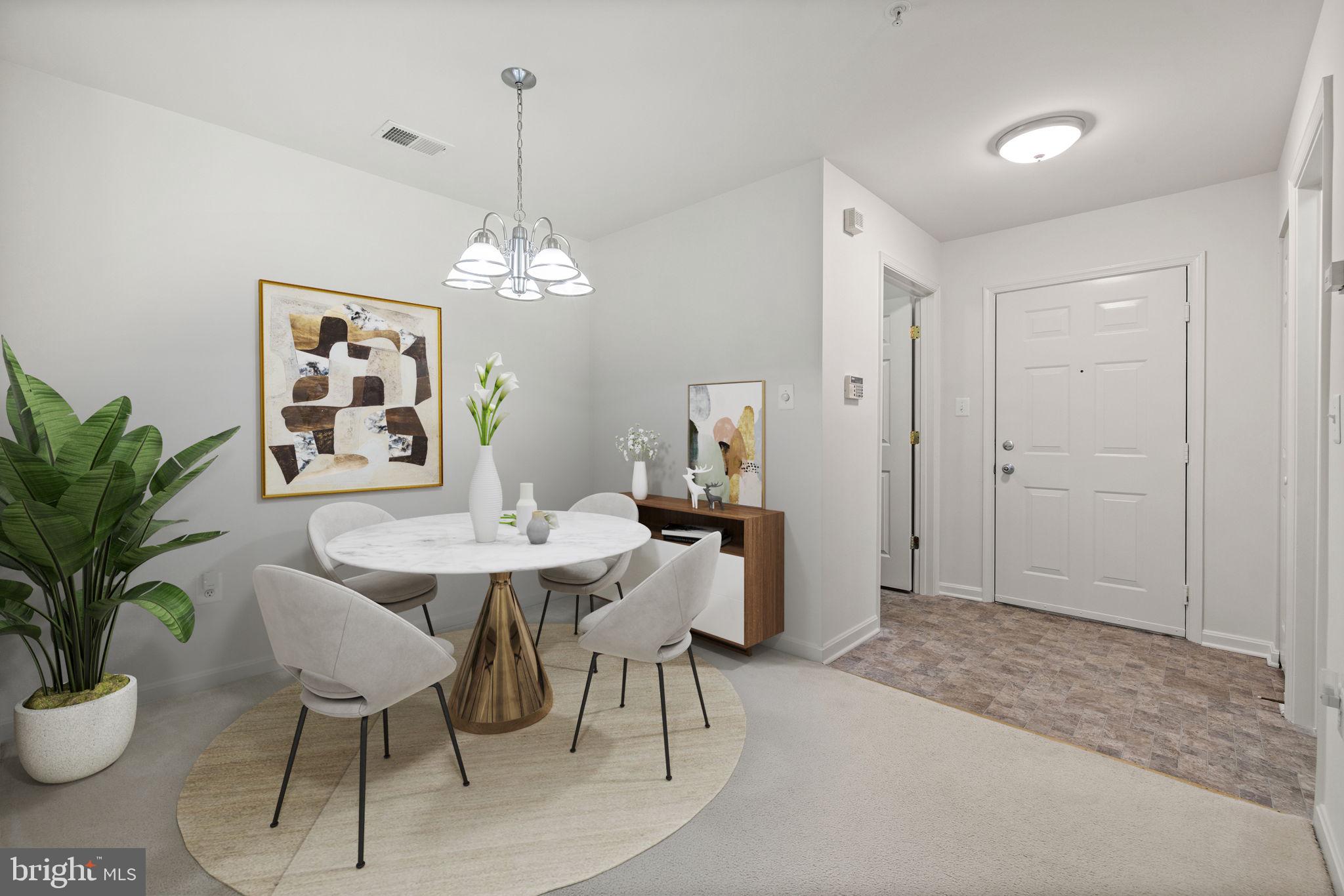 1049 Gardenview Loop, Unit 203 Woodbridge, VA 22191 - Photo 5 of 25 a dining room with furniture a chandelier and window