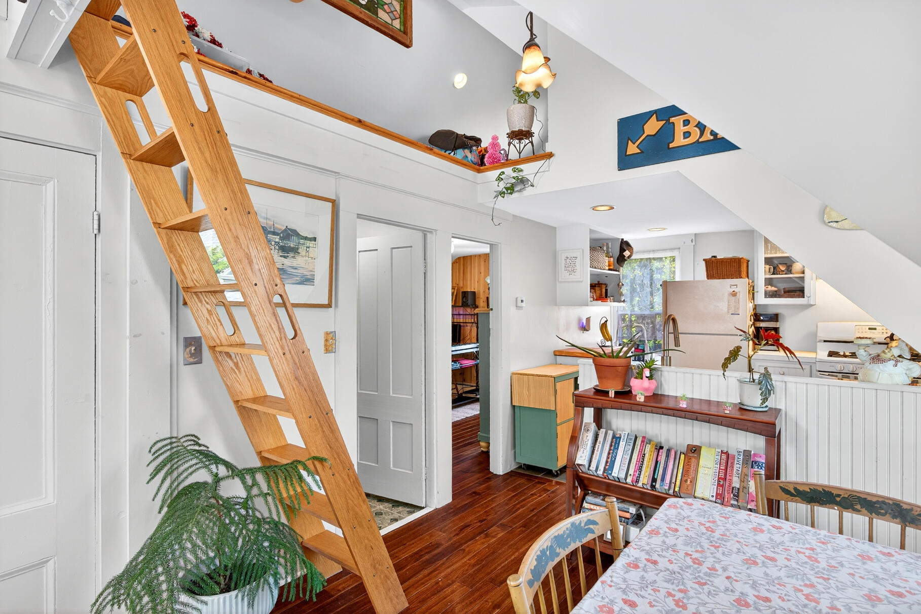4 Highland Road, Unit C Truro, MA 02666 - Photo 6 of 21 a bedroom with furniture and a book shelf