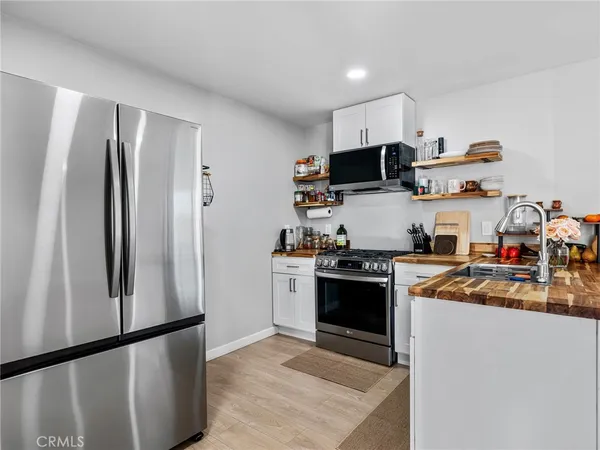 a kitchen with a stove and a microwave