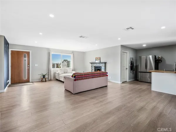 a spacious bedroom with a large bed and a couch