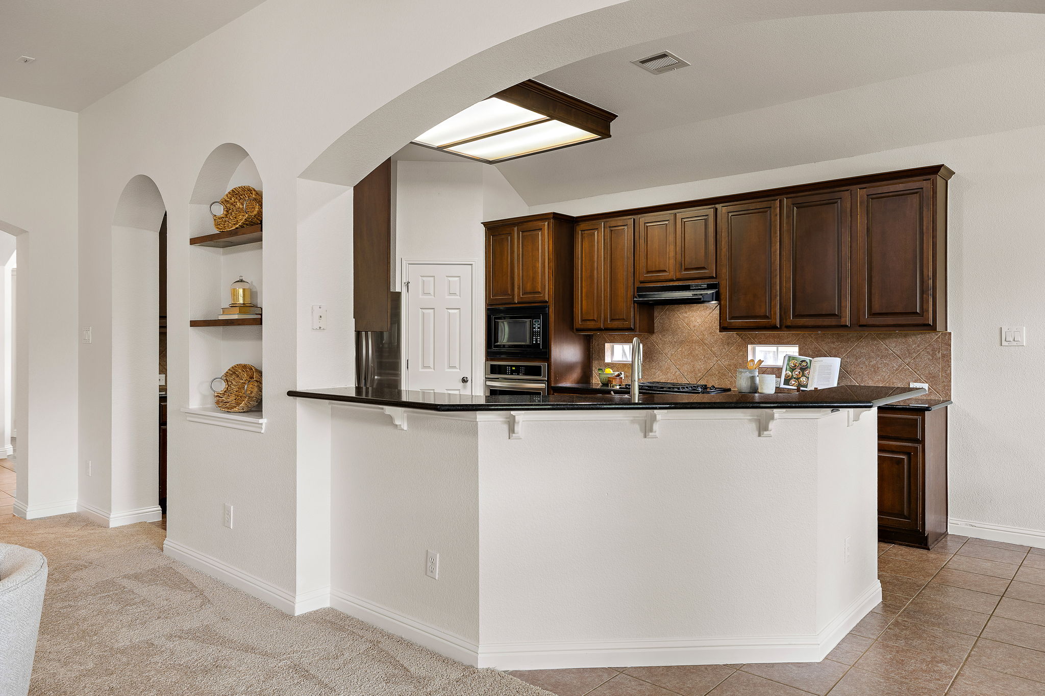 1115 Canyon Maple Road Pflugerville, TX 78660 - Photo 11 of 34 Kitchen breakfast bar and built-ins