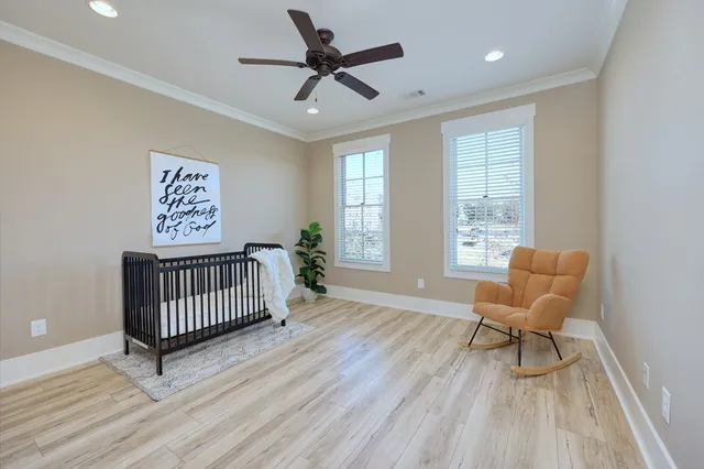 a bedroom with furniture and windows