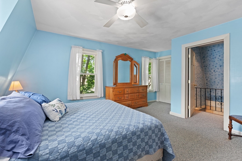 8 A 3rd Street Medford, MA 02155 - Photo 14 of 24 a bedroom with a bed and a dresser
