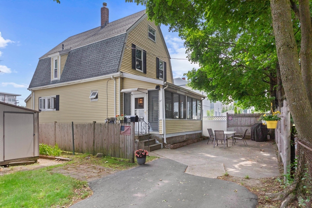 8 A 3rd Street Medford, MA 02155 - Photo 2 of 24 a view of a house with a yard and wooden fence