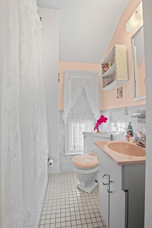8 A 3rd Street Medford, MA 02155 - Photo 21 of 24 a bathroom with a sink toilet and a shower