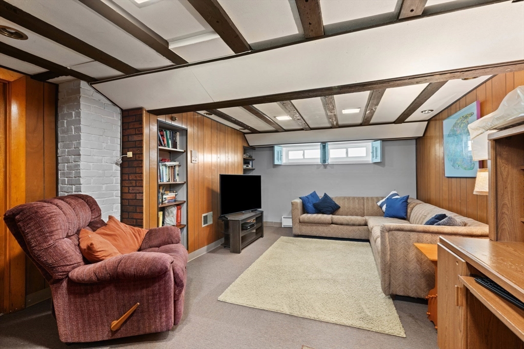 8 A 3rd Street Medford, MA 02155 - Photo 22 of 24 a living room with furniture and a flat screen tv