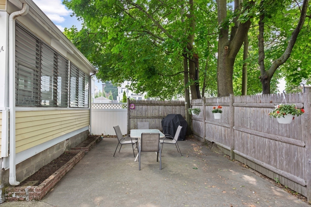 8 A 3rd Street Medford, MA 02155 - Photo 24 of 24 a view of a chair and tables in the back yard of the house