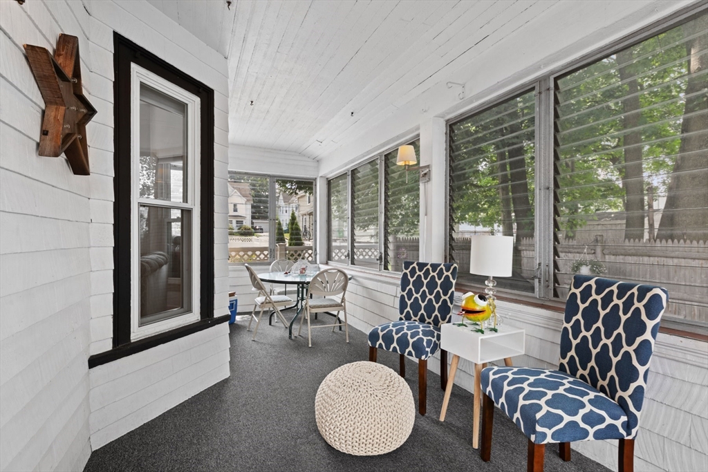 8 A 3rd Street Medford, MA 02155 - Photo 3 of 24 a living room with furniture and floor to ceiling windows