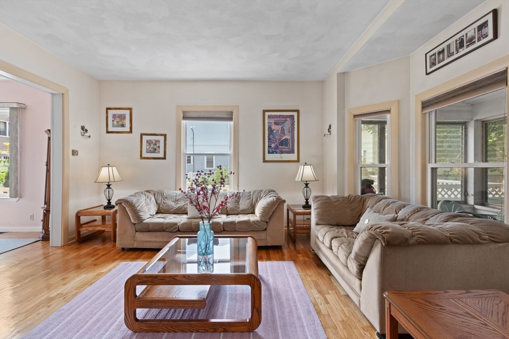 8 A 3rd Street Medford, MA 02155 - Photo 4 of 24 a living room with furniture and a wooden floor