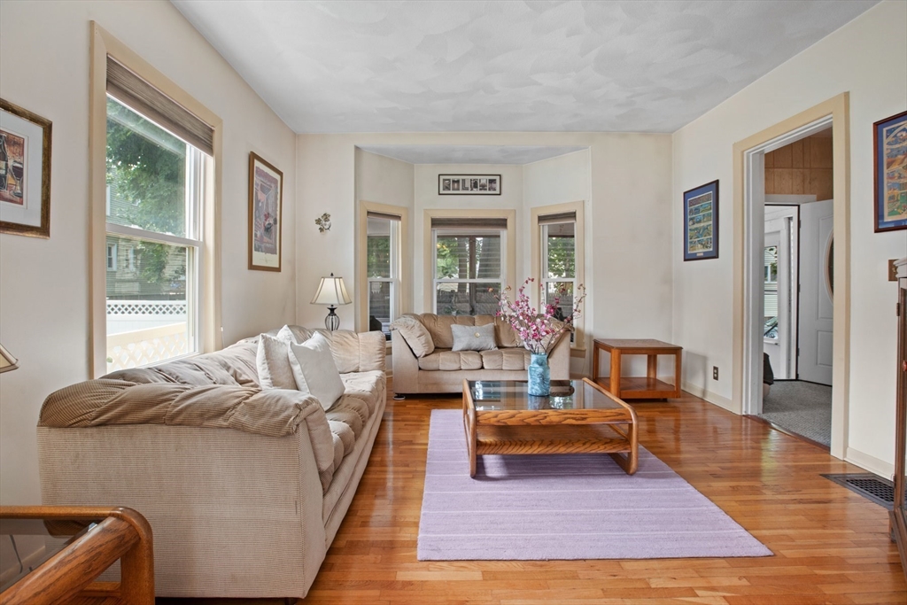 8 A 3rd Street Medford, MA 02155 - Photo 5 of 24 a living room with furniture rug and window