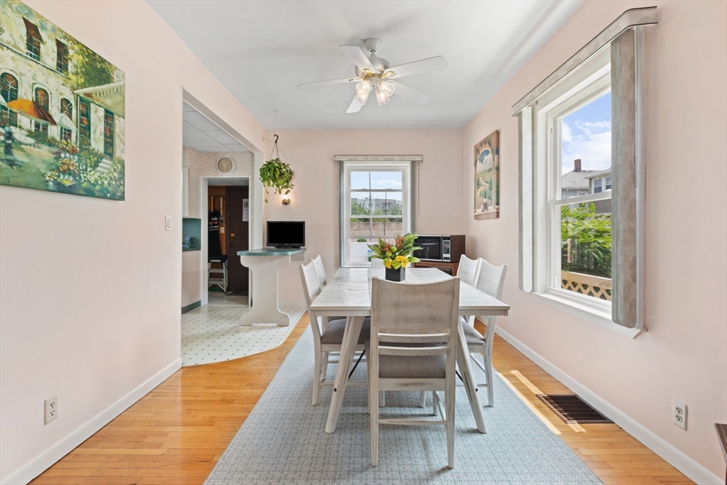 8 A 3rd Street Medford, MA 02155 - Photo 7 of 24 a dining room with furniture a livingroom view and wooden floor
