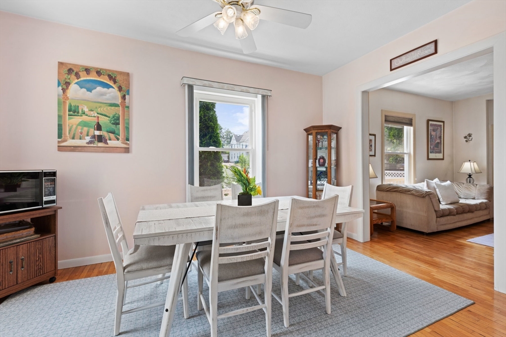 8 A 3rd Street Medford, MA 02155 - Photo 8 of 24 a view of a dining room with furniture a rug and wooden floor