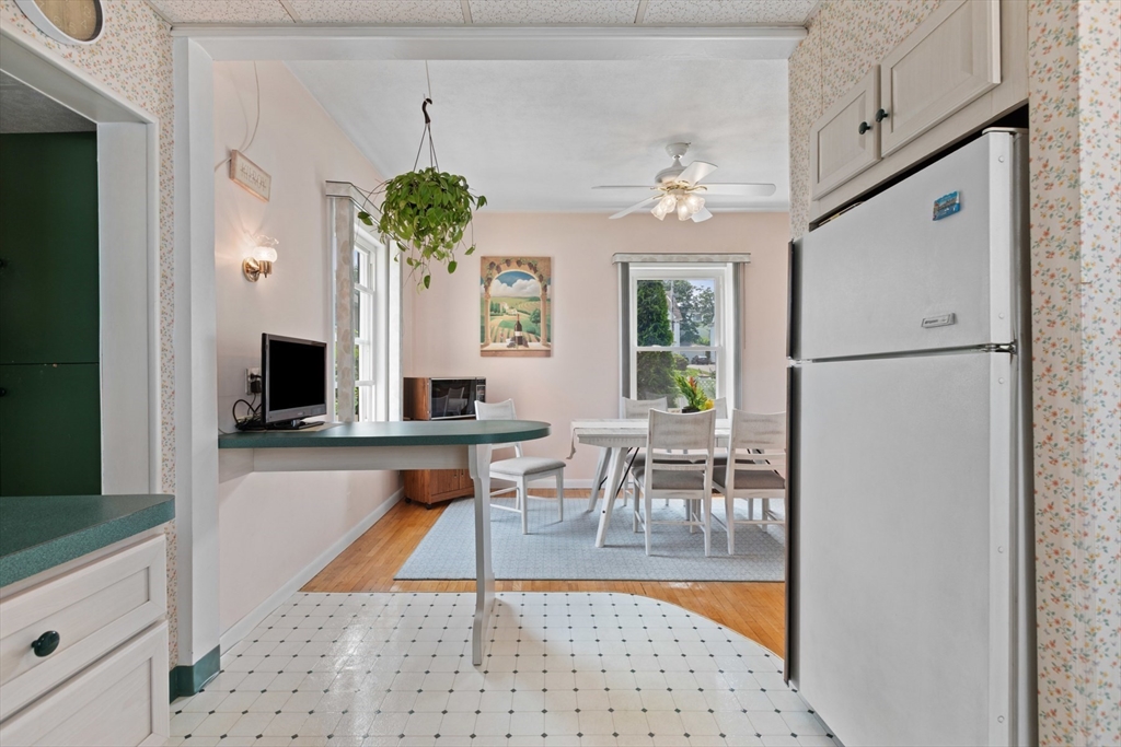 8 A 3rd Street Medford, MA 02155 - Photo 9 of 24 a living room with furniture wooden floor and a chandelier