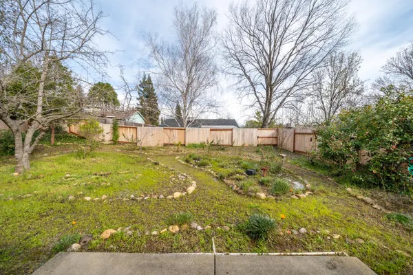 a view of yard with swimming pool