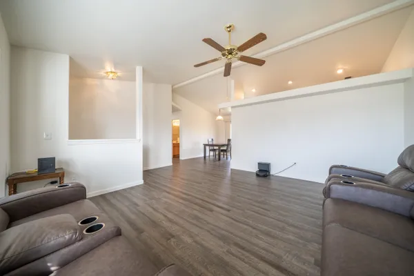 a view of an empty room and wooden floor