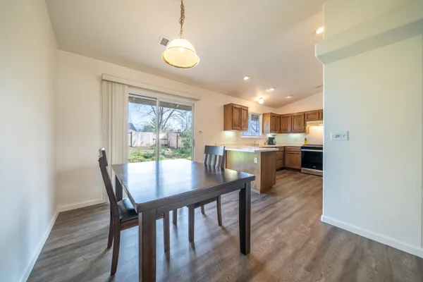 a view of a dining room with furniture window and wooden floor