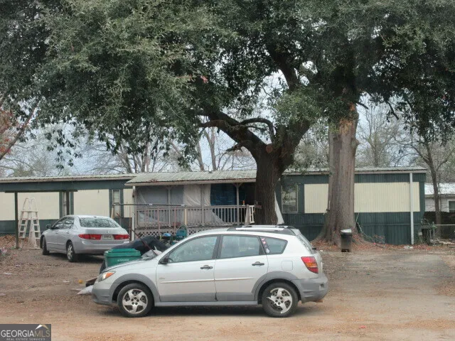 a view of a car parked in front of a house