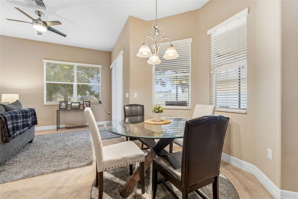 4460 Birchfield Loop Spring Hill, FL 34609 - Photo 15 of 38 a view of a dining room with furniture window and outside view