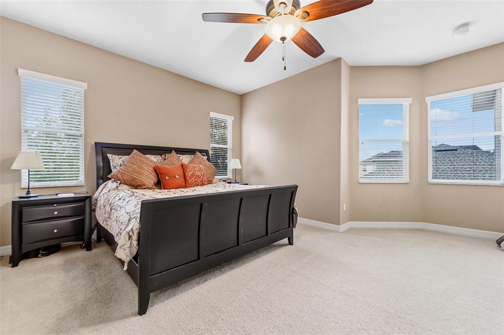 4460 Birchfield Loop Spring Hill, FL 34609 - Photo 19 of 38 a bedroom with a bed and a window