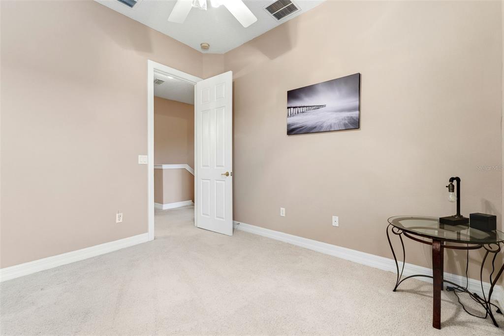 4460 Birchfield Loop Spring Hill, FL 34609 - Photo 28 of 38 a view of a workspace with furniture and a potted plant