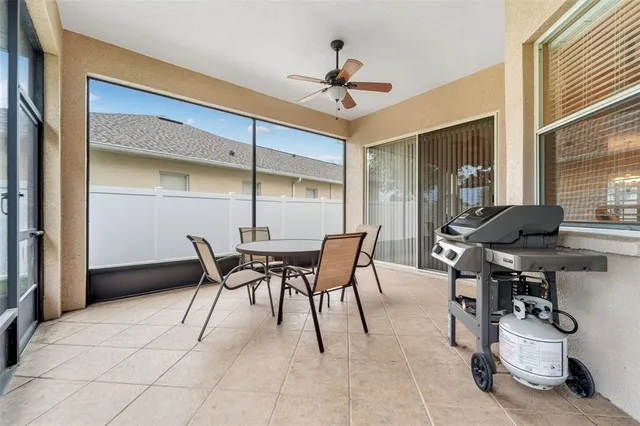 a dining room with furniture and a chandelier
