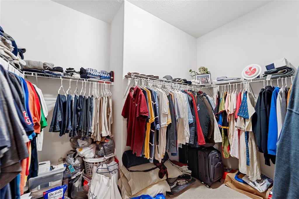 4460 Birchfield Loop Spring Hill, FL 34609 - Photo 37 of 38 a view of walk in closet with clothes