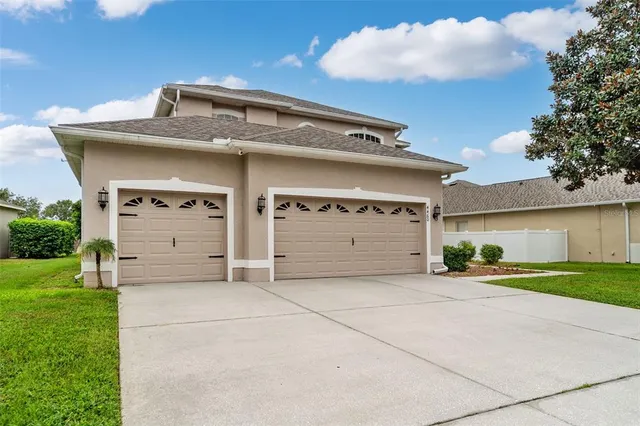 a front view of a house with a garage