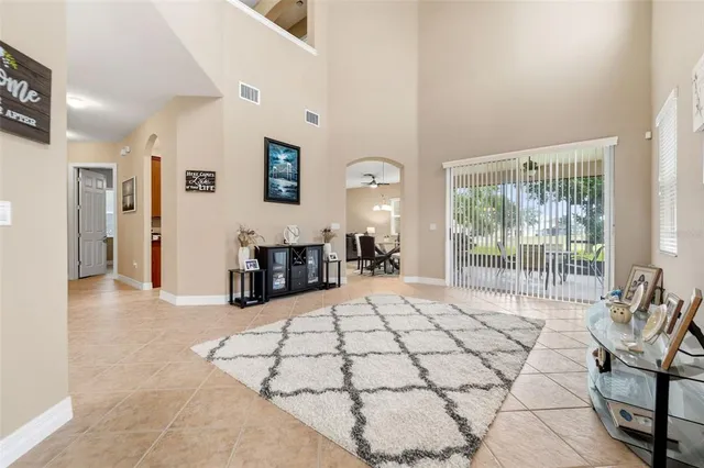a large room with a large bed and a large window